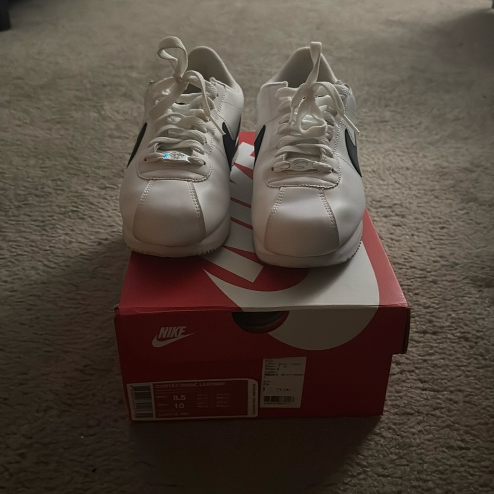 Nike Cortez  white with black swoosh. Men’s 8.5 or Women’s 10
